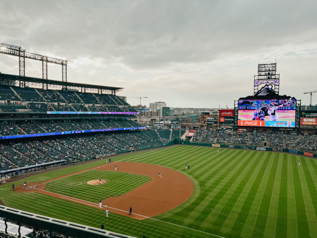 The Colorado Rockies field and stadium during a game, one of the best things to do in Denver Colorado in the summer. 