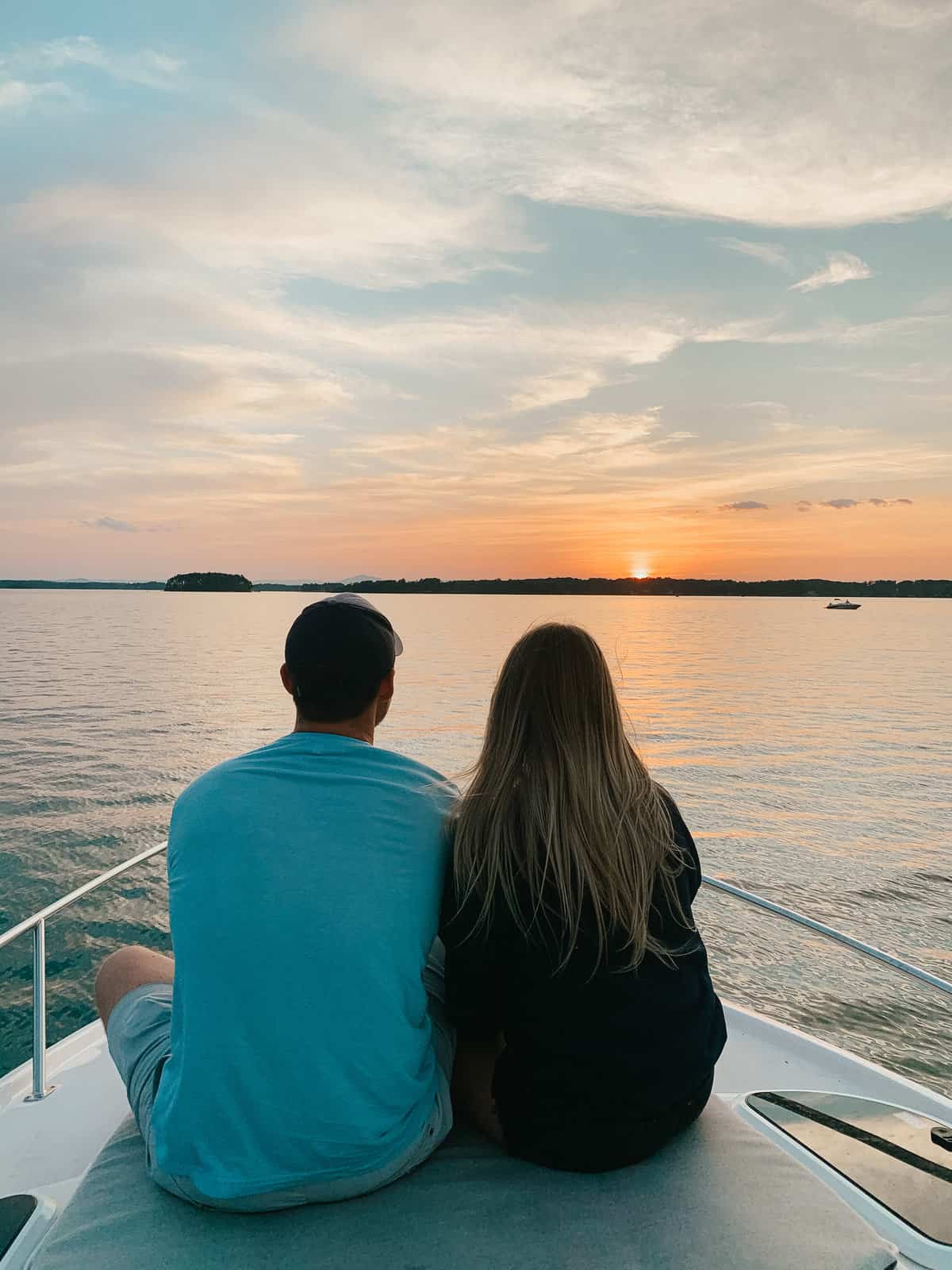 Sam and Abby watching a sunset on a boat at SML.