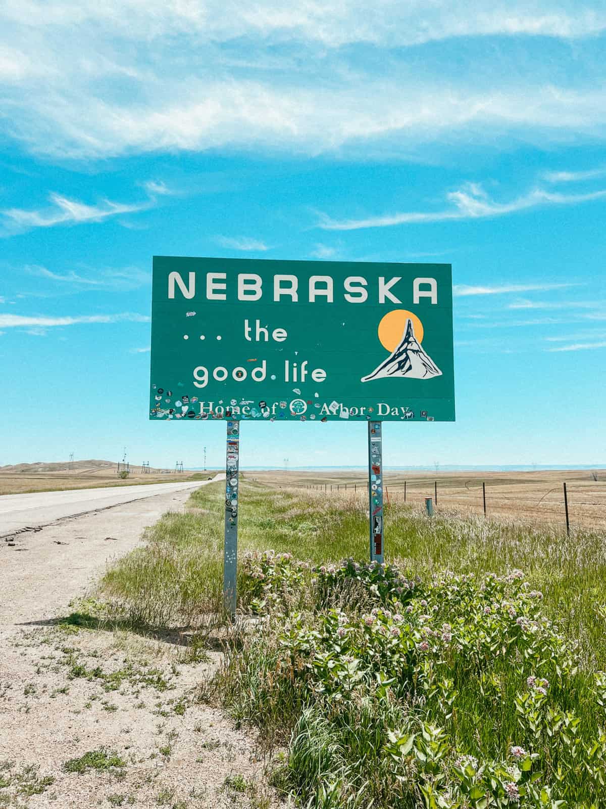 The Nebraska welcome sign with blue skies.