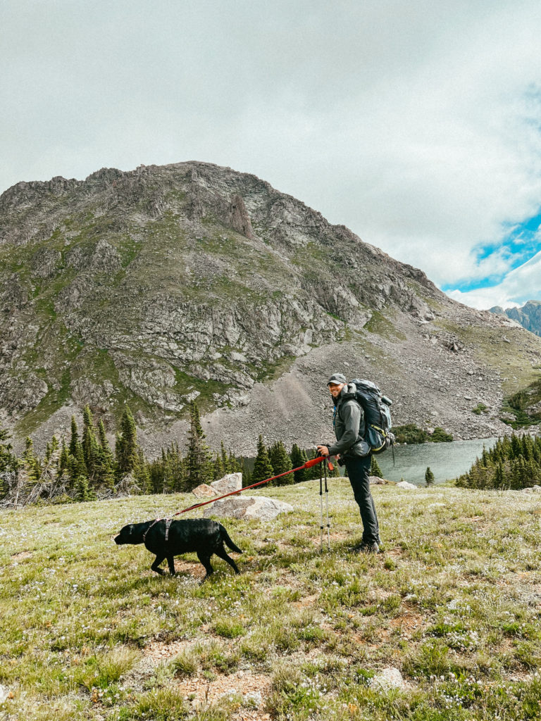 Sam and Clover backpacking in Colorado with one of the best backpacking pillows for side sleepers in Sam's pack. 