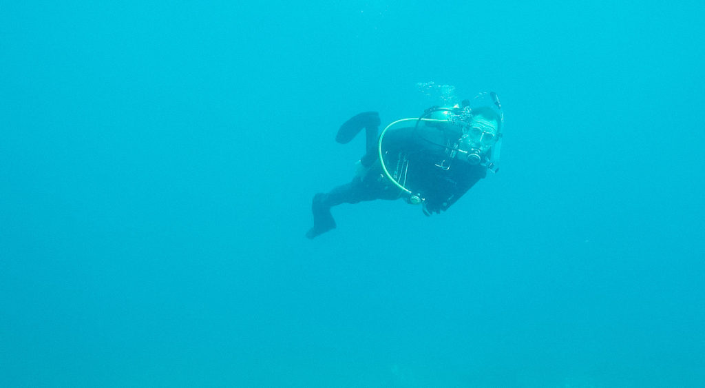 Sam scuba diving in Kauai, one of the best things to do in Kauai for couples.