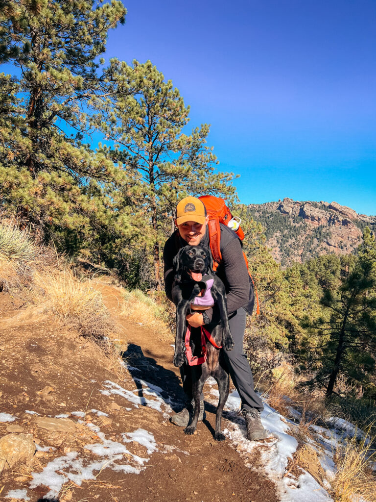 Sam and Clover on a trail with some of the best energy bars for hiking.