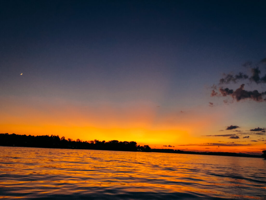 The best things to do in Smith Mountain Lake, catching sunsets on a boat. 