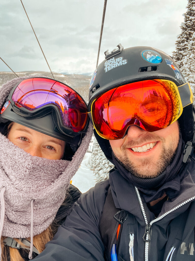Abby and Sam on a chairlift at one of the resorts known for the best snowboarding in the US.