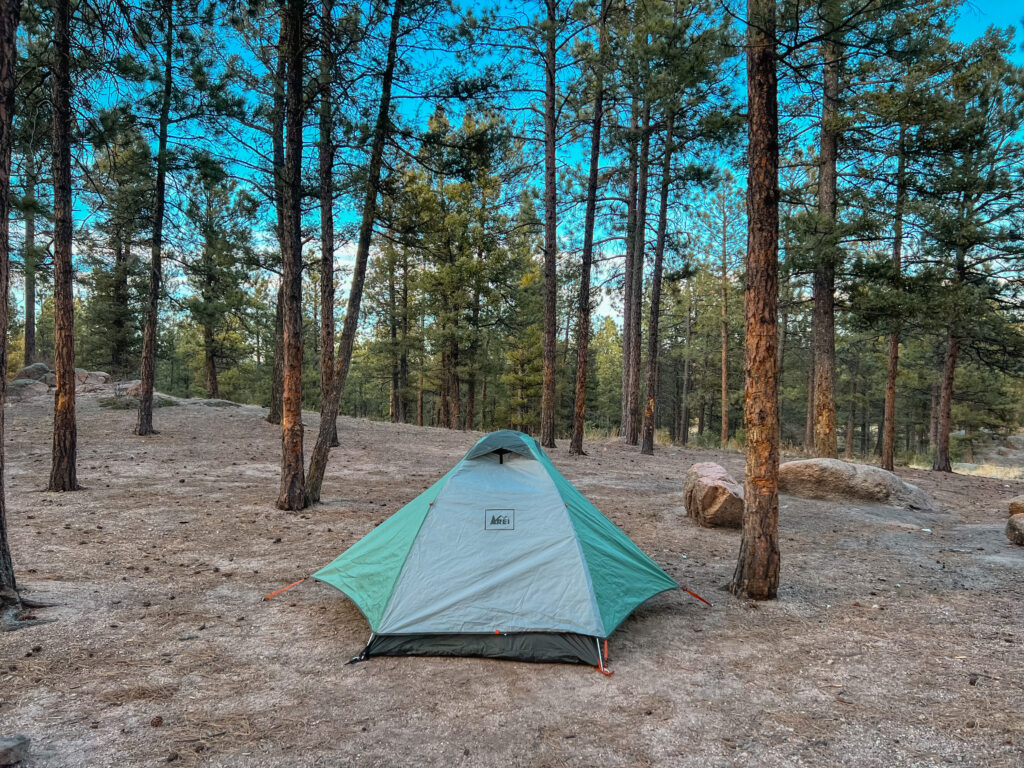 The REI Half Dome 2 Plus tent set up in the Colorado wilderness for a camping weekend.