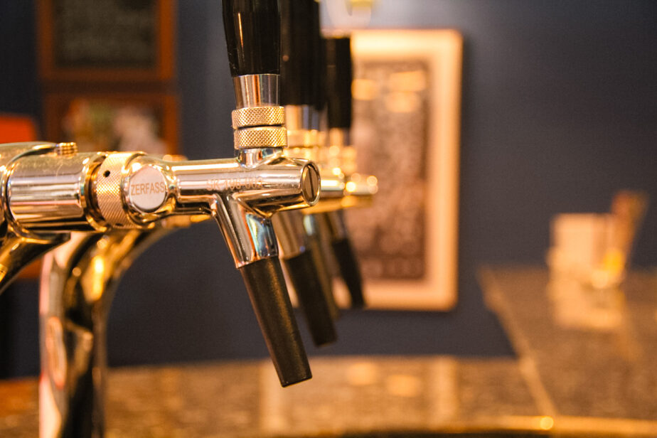 Beer taps on display at a brewery.