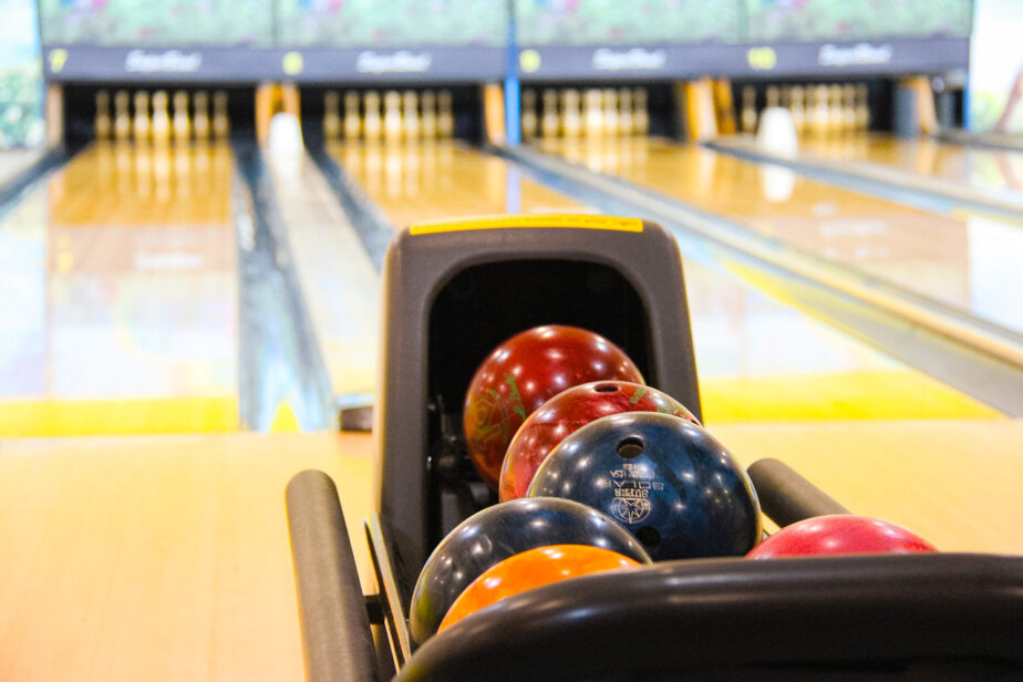 A bowling alley with colorful bowling bowls.
