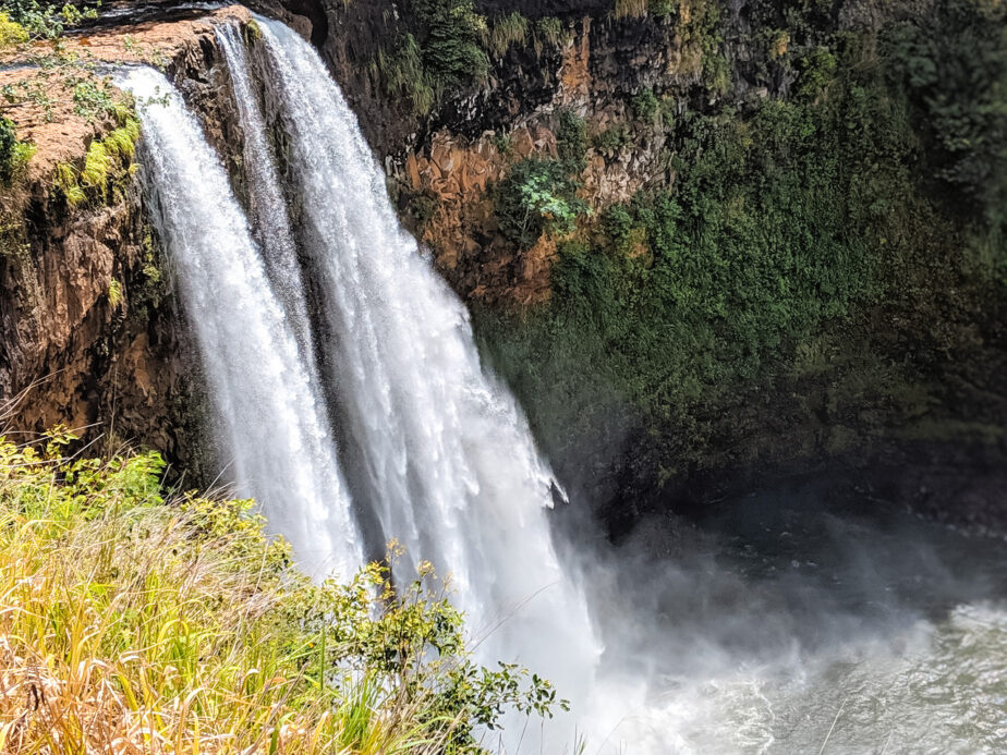 A waterfall in Kauai, one of the top attractions to see while on a Kauai kayak tour.