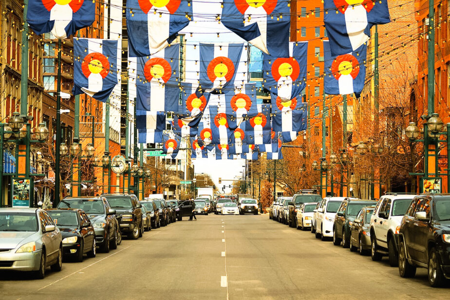Larimer Square with Colorado flags hanging above, one of the most popular areas in downtown Denver.