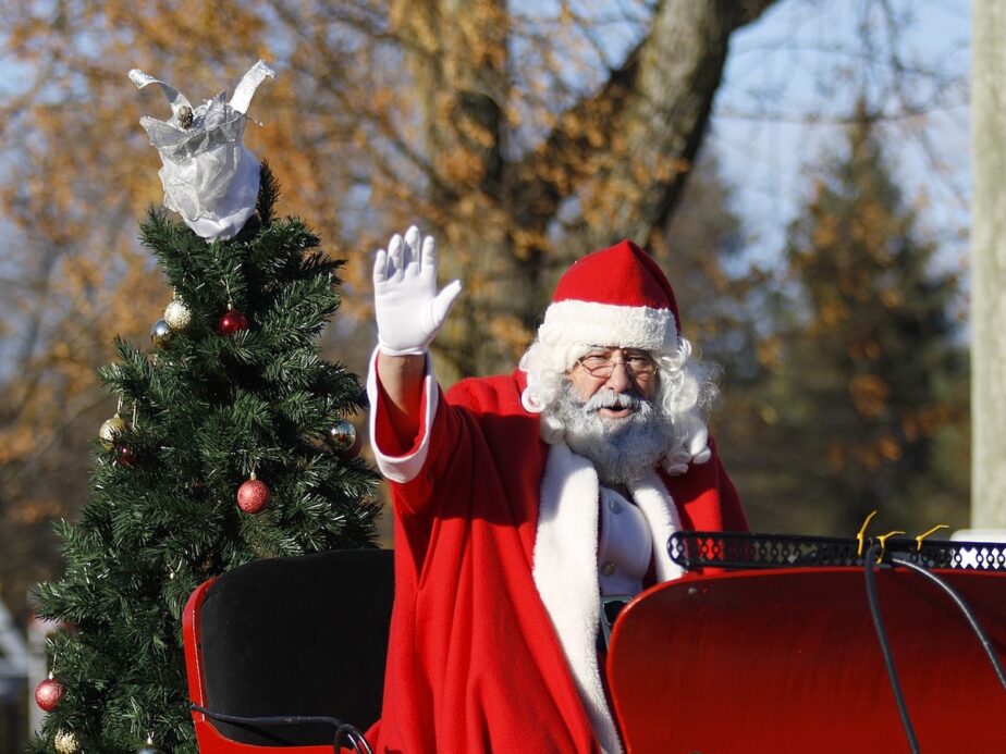 Santa Claus on a sleigh during a Christmas Parade.