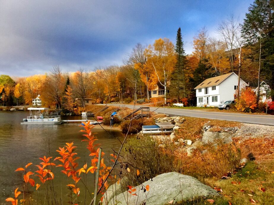 A town in New Hampshire with fall foliage. 