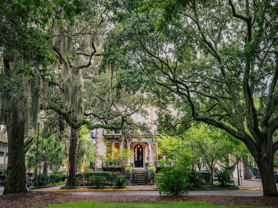A historic building in Savannah surrounded by trees.