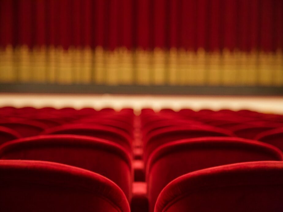 Red opera seats at a theater.