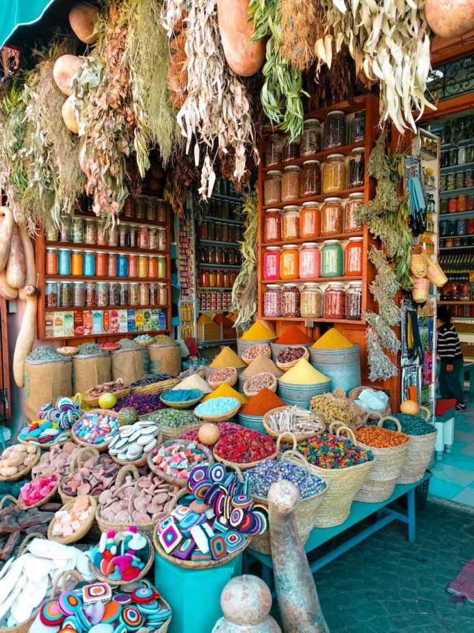Colorful crafts and local spices at a market in Morocco.