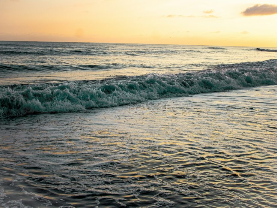 The ocean waves crashing at sunset along the shores at Emerald Isle.
