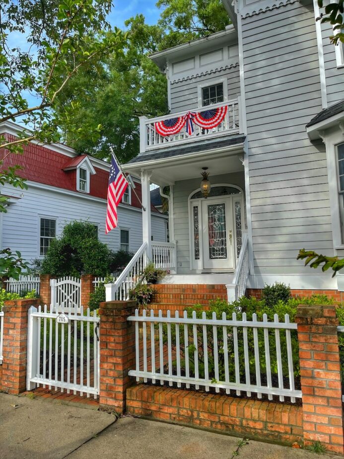 Fourth of July banners and the American Flag on a house in New Bern.