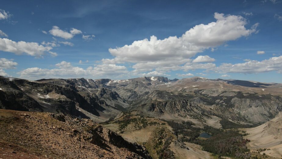 The Beartooth Mountains in Montana with partly cloudy skies.