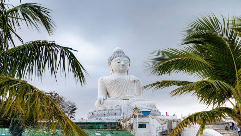 The Big Buddha statue sitting on top of a hill in Phuket.
