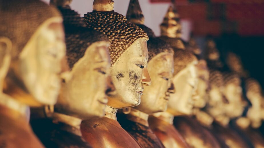 A collection of gold Buddha statues.