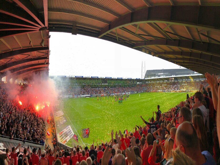A football game in Denmark as the crowd celebrates.