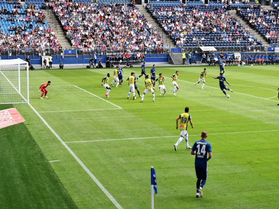A football game in Germany as a team defends their goal.