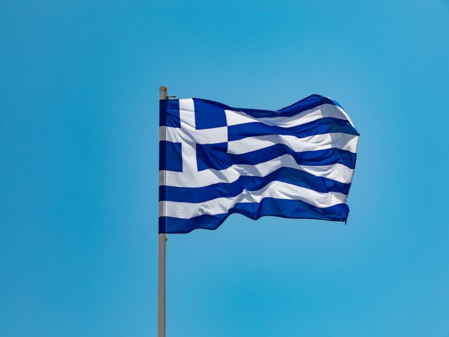 The Greece flag flying in the wind.