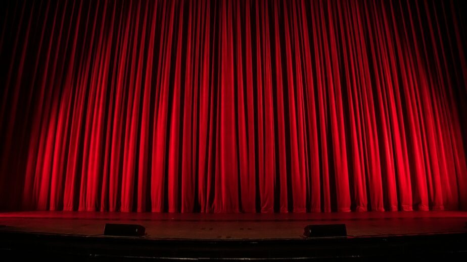 Red curtains at a theater.