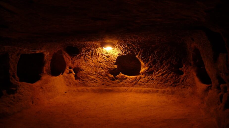 An underground town lit up by a light.