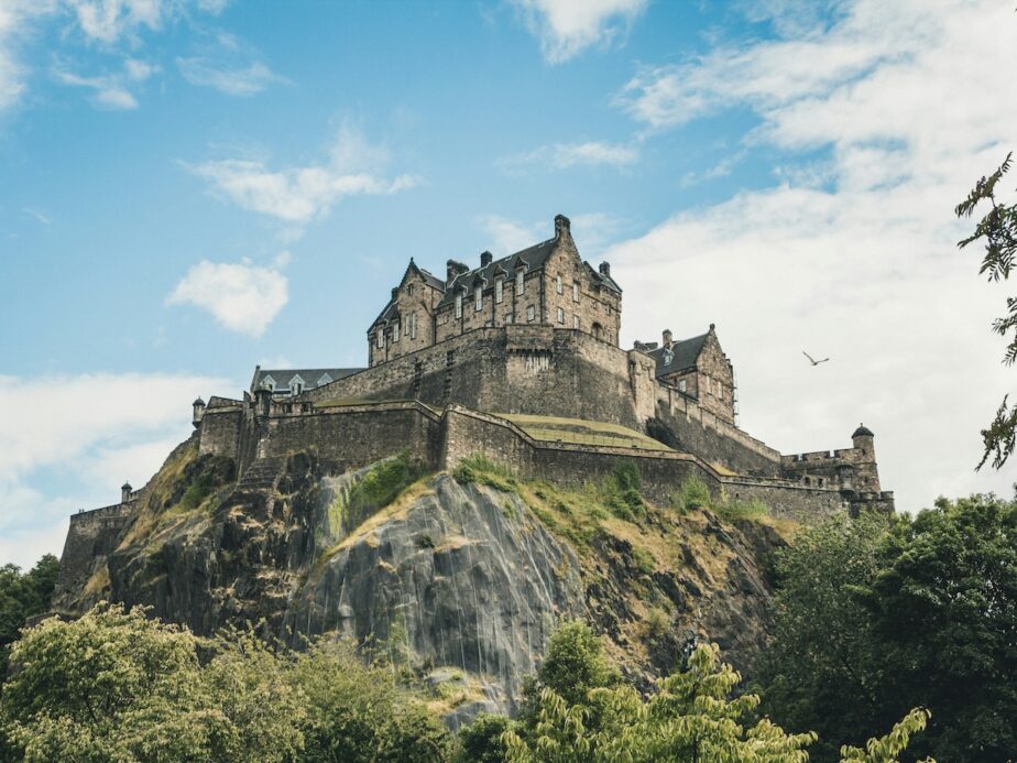 A castle in Edinburgh sitting on a hill.