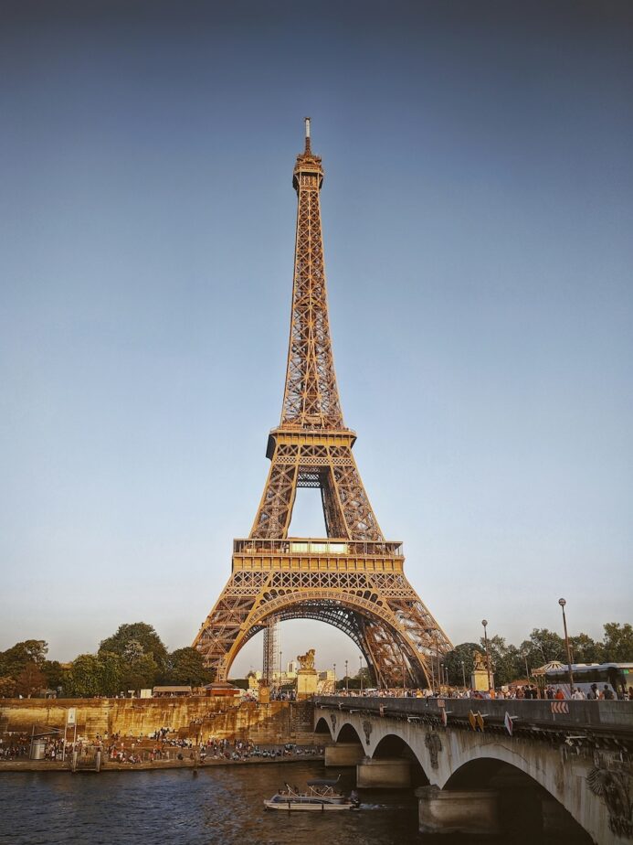 The Eiffel Tower in Paris France with blue skies.