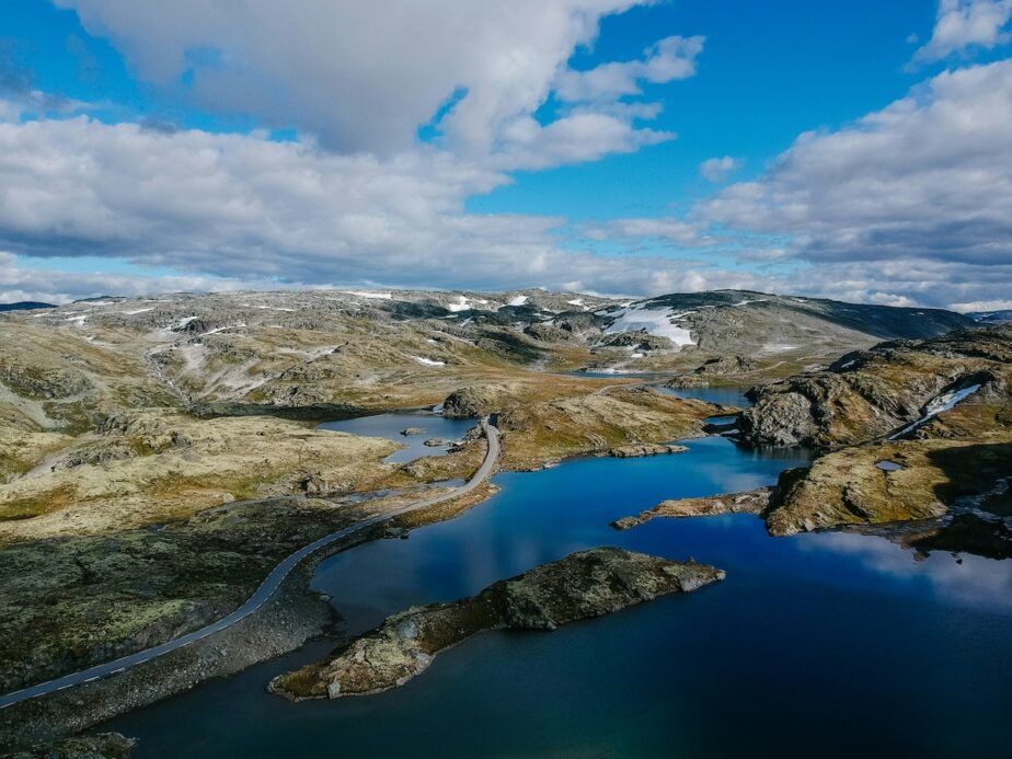 The Norwegian Fjords with partially cloudy skies.