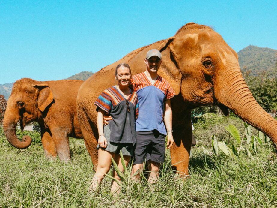 Abby and Sam in Thailand with elephants.