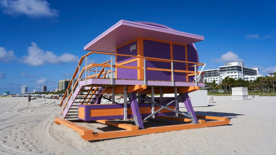 A purple and orange lifeguard tower in Miami.