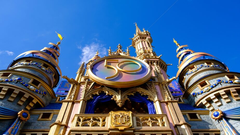 The Disney Castle with blue skies behind it.